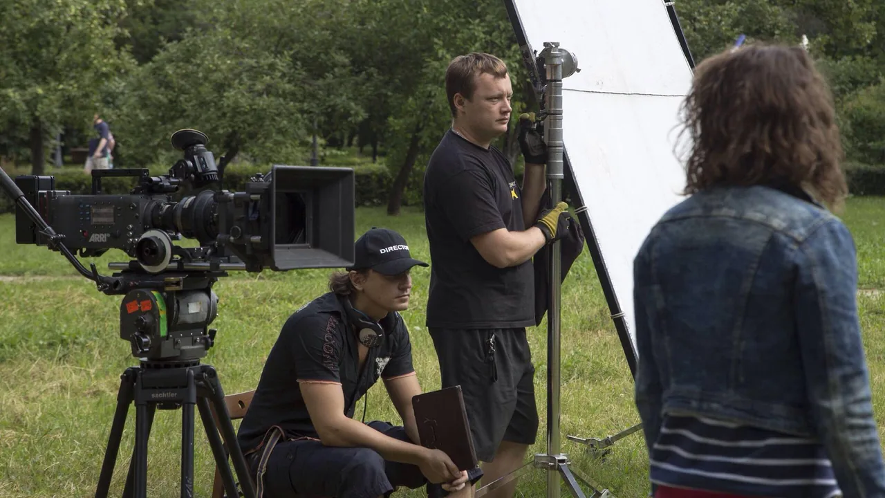 A camera and crew on an outdoor set
